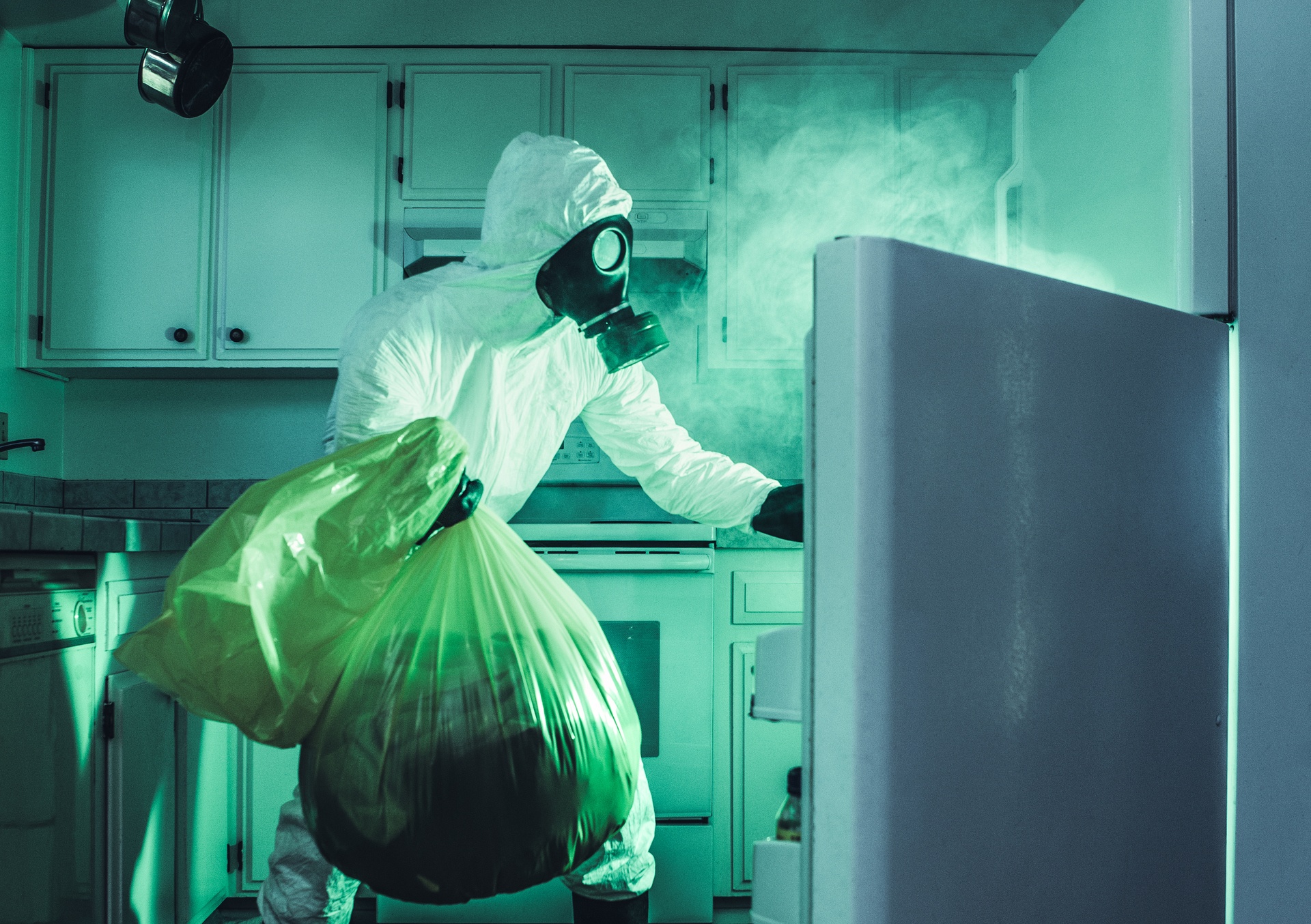Man In Hazmat Suit Cleaning Refrigerator